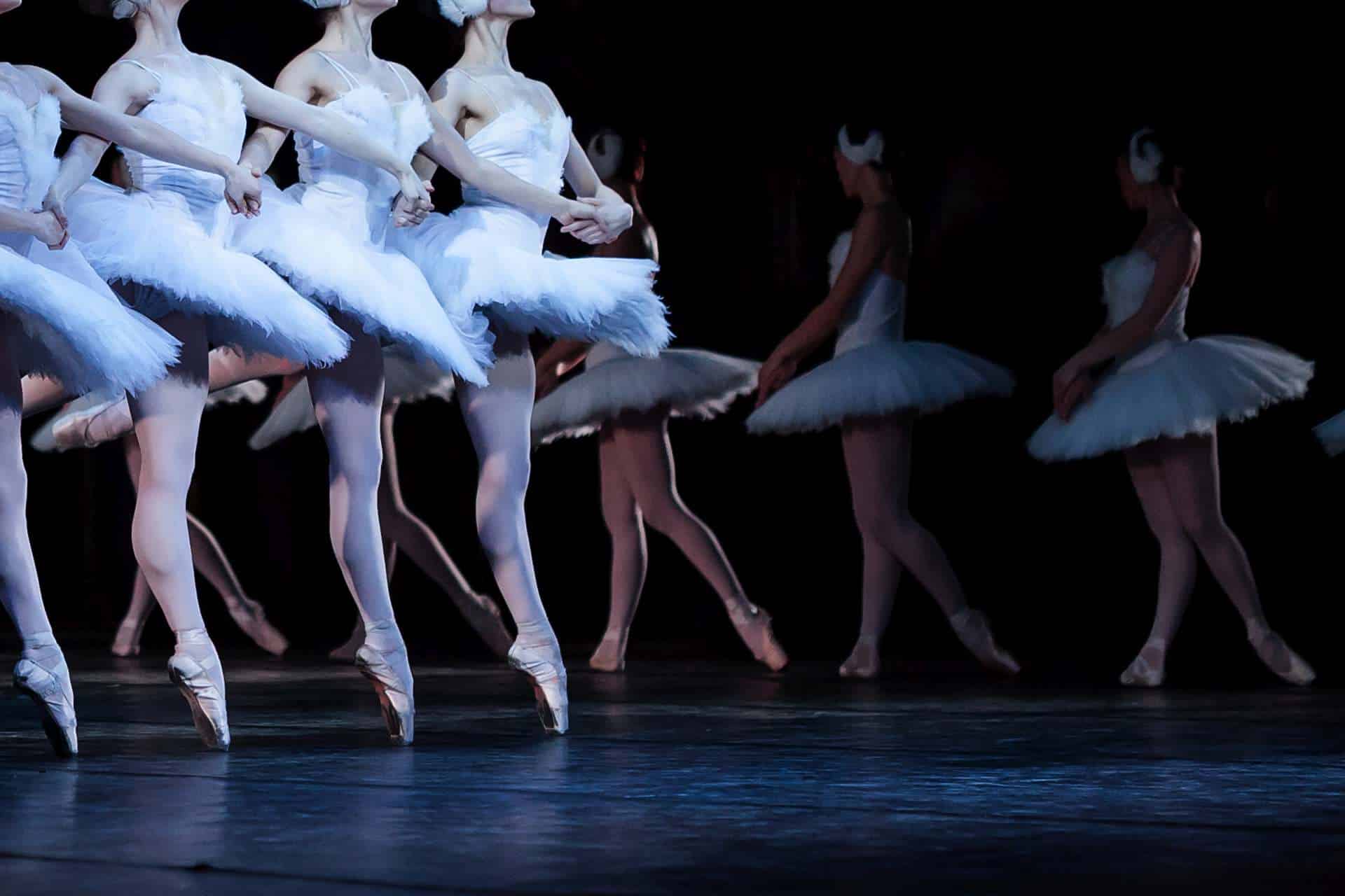 Girls Wearing Dresses Decorated with Feathers Dancing