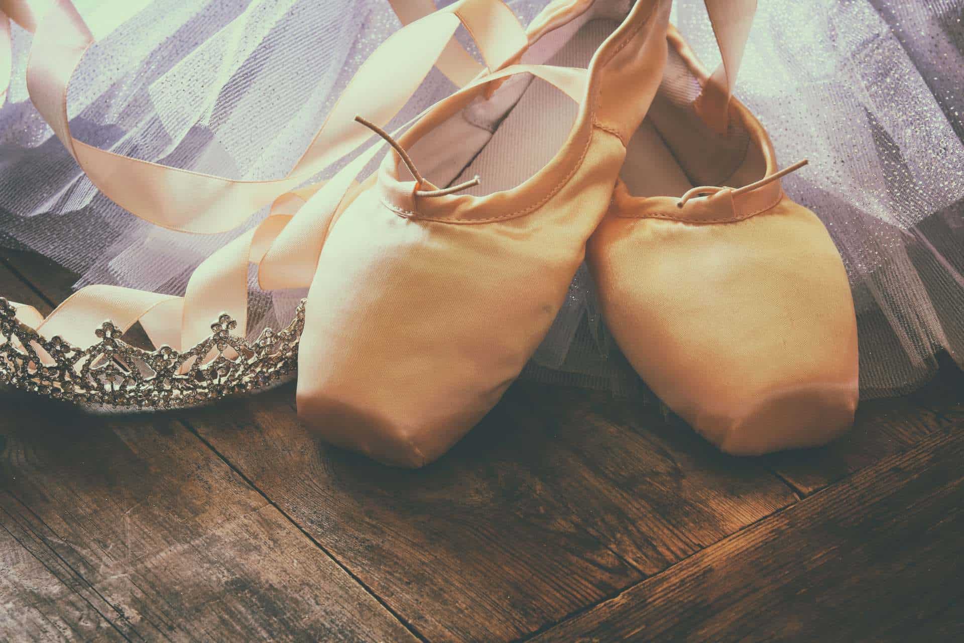 Silk Pointe Shoes on Wooden Floor